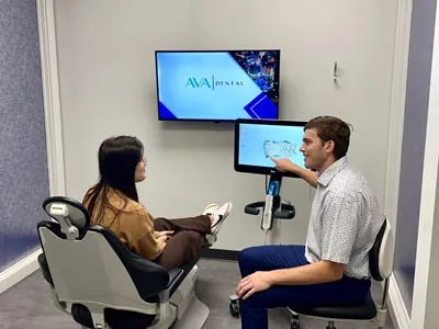 Dr. Ranshaw discussing dental treatment with a new patient at AVA Dental