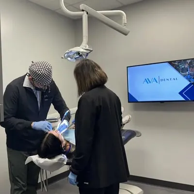Dr. Jon providing dental care to a patient at AVA Dental
